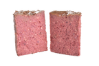 Brit Premium Adult Wet Dog Food with Chicken & Hearts loaf cut in half  on a white background