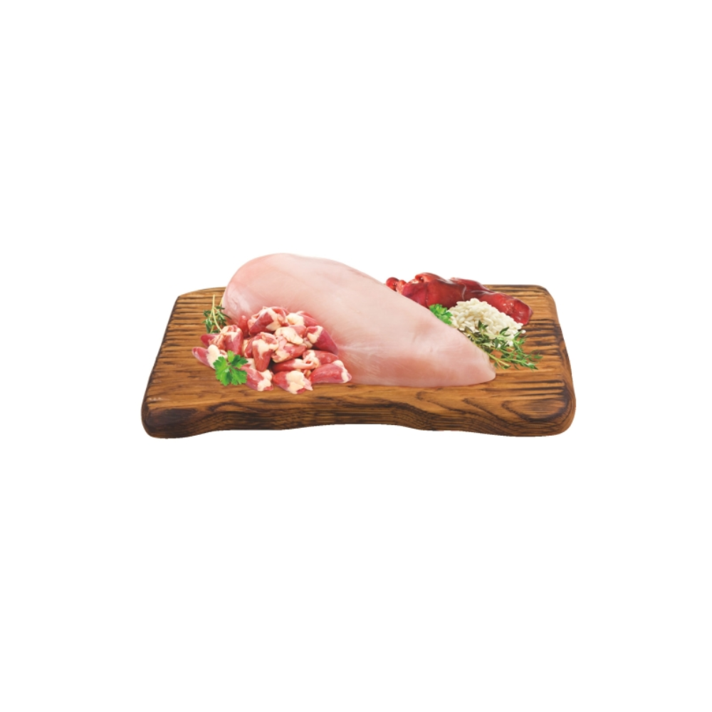 Chicken sausage ingredients on a wooden cutting board with chopped vegetables on a white background