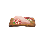 Chicken sausage ingredients on a wooden cutting board with chopped vegetables on a white background