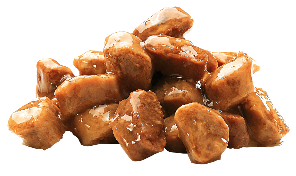 Chunks of Brit Premium Adult Sterilised Chicken Wet Cat Food on a white background