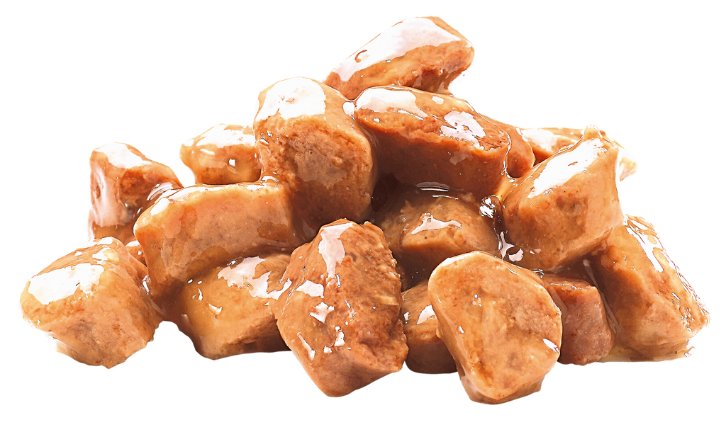Glistening chunks of Brit Premium Adult Cod Fish in Gravy Wet Cat Food on a white background